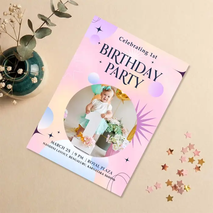 A pink and purple celestial first birthday invitation featuring a baby's photo, stars, and modern graphics.