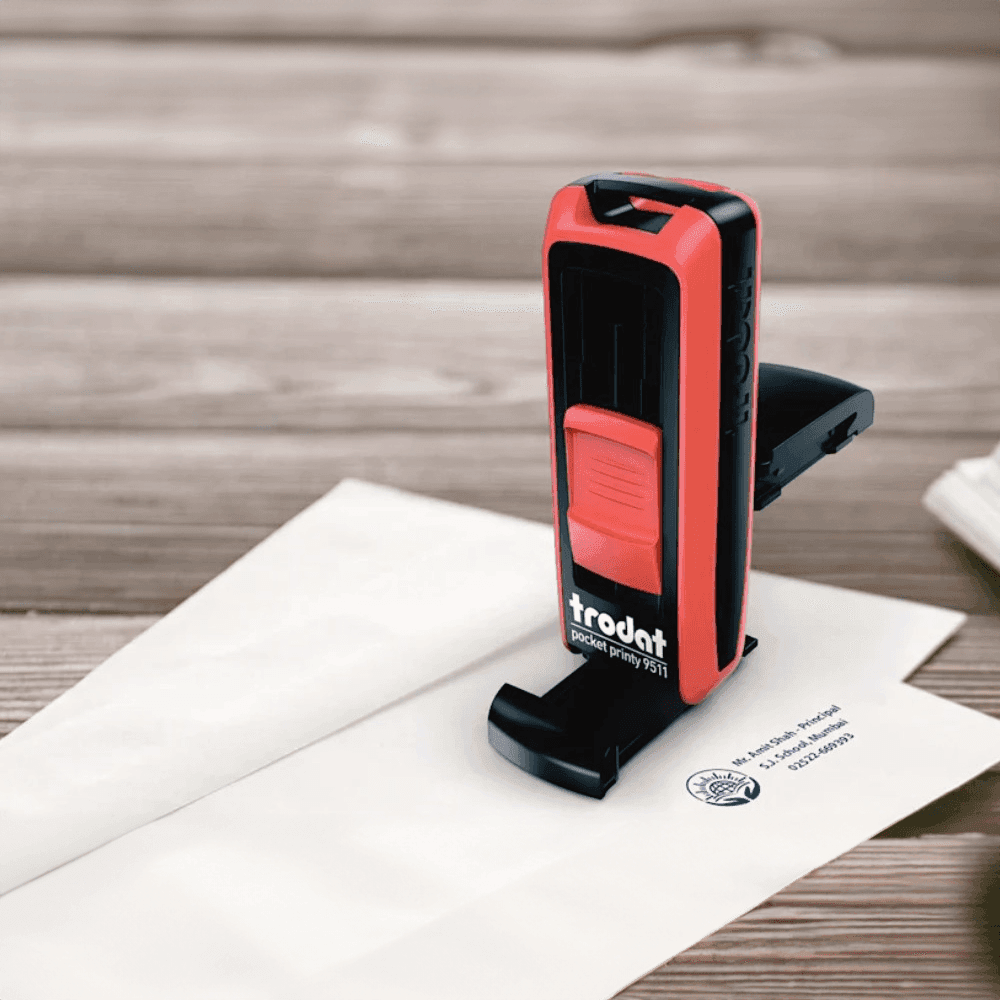 A Trodat pocket stamp stamping an envelope, perfect for Custom Stamps in Bangalore and everyday Packing Stamps needs.