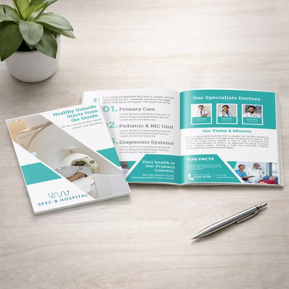 A healthcare-themed A5 booklet shown closed and opened to its specialist doctor page on a light wooden table next to a pen
