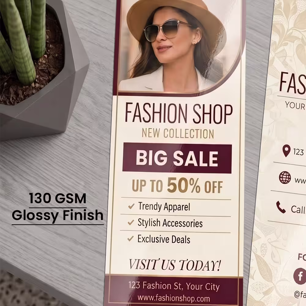Close-up of a printed fashion promotional DL flyer highlighting its 130 GSM glossy finish