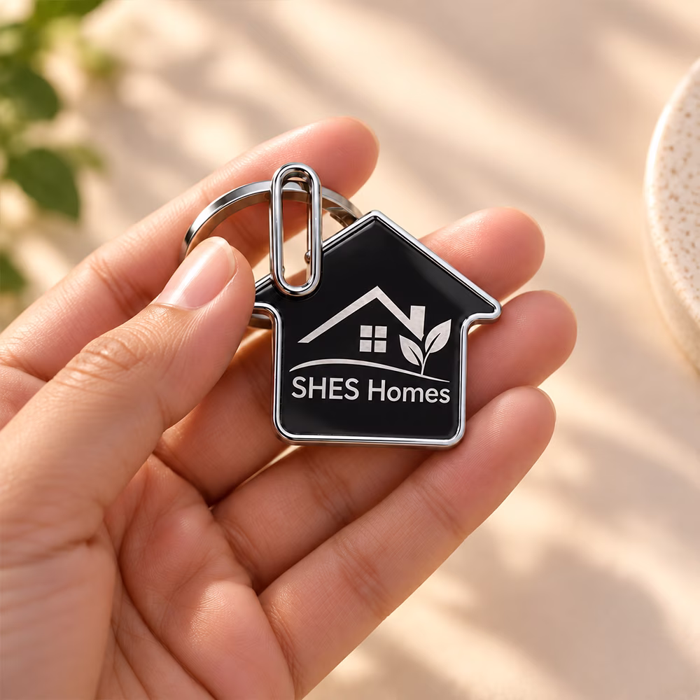 Custom house-shaped home keychain with engraved logo