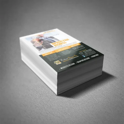 Stack of professionally printed business flyers showcasing a clean and engaging design, featuring details about services, pricing, and contact information, placed on a gray textured surface.