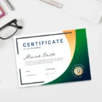Landscape certificate for Mariah Smith with green and orange curves, a gold seal, and glasses on a desk.