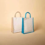 Two upright jute bags: one natural tan and one with blue accents, both featuring a clean white front.