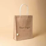 Front view of a vertical jute tote bag featuring white cotton rope handles and "Your Logo" text in the center.