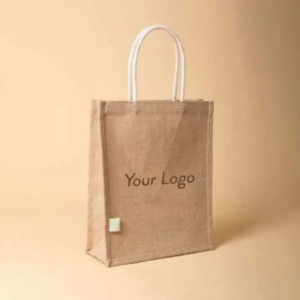 Front view of a vertical jute tote bag featuring white cotton rope handles and "Your Logo" text in the center.