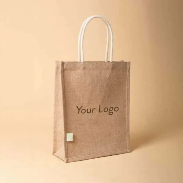 Front view of a vertical jute tote bag featuring white cotton rope handles and "Your Logo" text in the center.