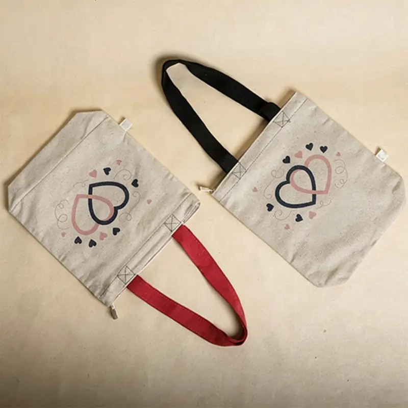 Two canvas tote bags with romantic heart patterns, offering eco-friendly valentine's day gift ideas for loved ones.