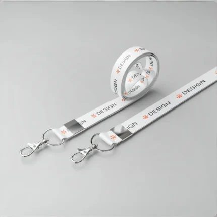 Custom white lanyard with side lever hook, metal clasp, printed ‘DESIGN’ text with orange icon—perfect for office or events.