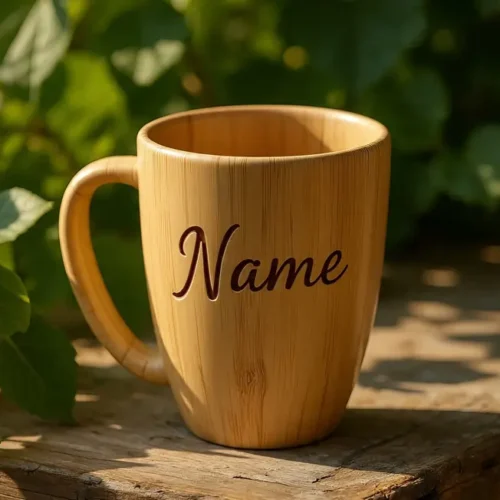 Personalized wooden mug with the word 'Name' engraved, placed on a rustic wooden surface outdoors