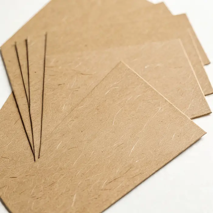 Eco-friendly kraft printing material for your business displayed on a white background.