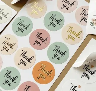 Colorful round labels with Thank You text in various pastel shades, perfect for adding a personal touch to packaging.