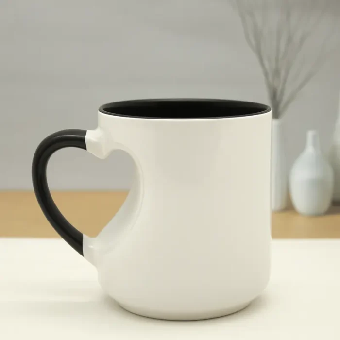 Black ceramic custom mug with heart-shaped handle.