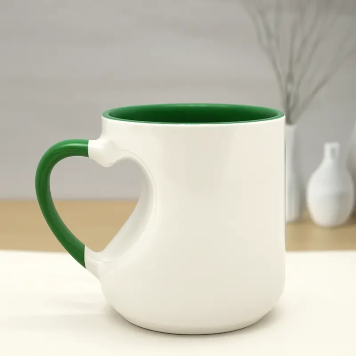 Green ceramic custom mug with heart-shaped handle.