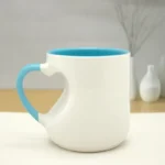 Light blue ceramic custom mug with heart-shaped handle.