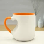 Orange ceramic custom mug with heart-shaped handle