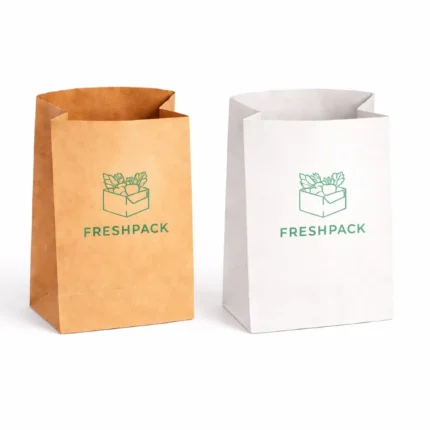 Two Small Paper Pouch grocery bags, one brown and one white, side-by-side. Both feature a green logo of a produce box with the text "FRESHPACK" below.
