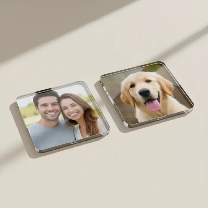 Two square acrylic photo coasters on a light background. One features a smiling couple, and the other a golden retriever puppy.