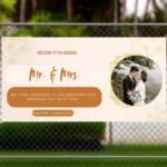 Wedding banner displayed on a fence, featuring “Mr. & Mrs.” text, a photo of the couple, floral accents, and details about the celebration time and venue.