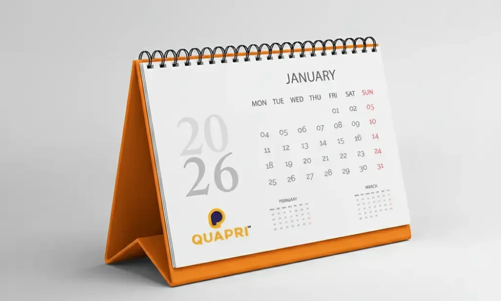 Desk calendar for 2026 with an orange base. A Top Calendar Printing Tips is to choose vibrant colors and update the year.