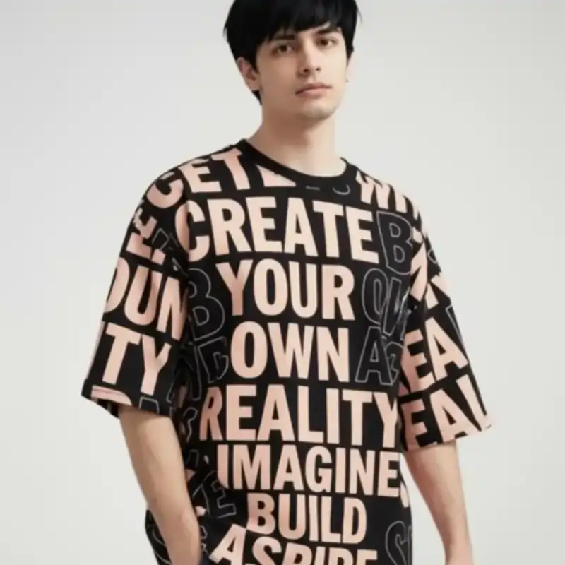 A man wearing a black oversized T-shirt with an all-over print of large, overlapping, light peach block letters. Best T-shirt Design Ideas