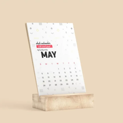 A Desk Calendar With Wooden Stand displaying the month of May. The calendar has a modern, minimal design with geometric patterns and an A5-sized full-colour sheet.