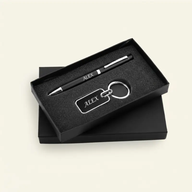 Personalized black and silver metal pen and keychain gift set in a luxury black box, an elegant choice for best new year gifts.