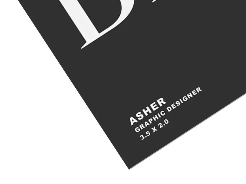 Matte black business card corner with clean white typography and minimalist professional design.