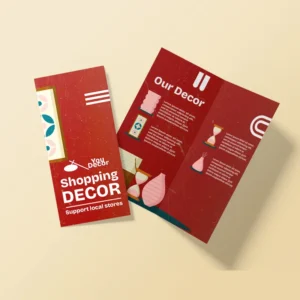 Vibrant red DL bi-fold brochure for "Shopping Decor" featuring white text, abstract geometric shapes, and home decor icons.