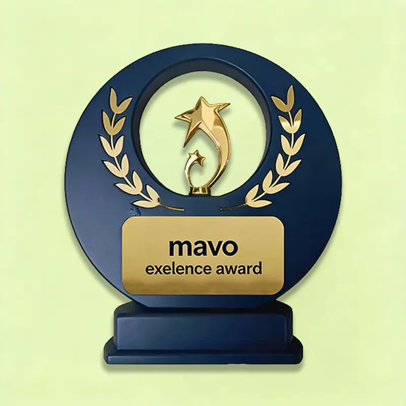 A navy circular trophy with gold laurel leaves and a gold plate reading "mavo excellence award.