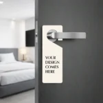 Customizable cream-colored door hanger mockup with text "Your Design Comes Here" on a door.