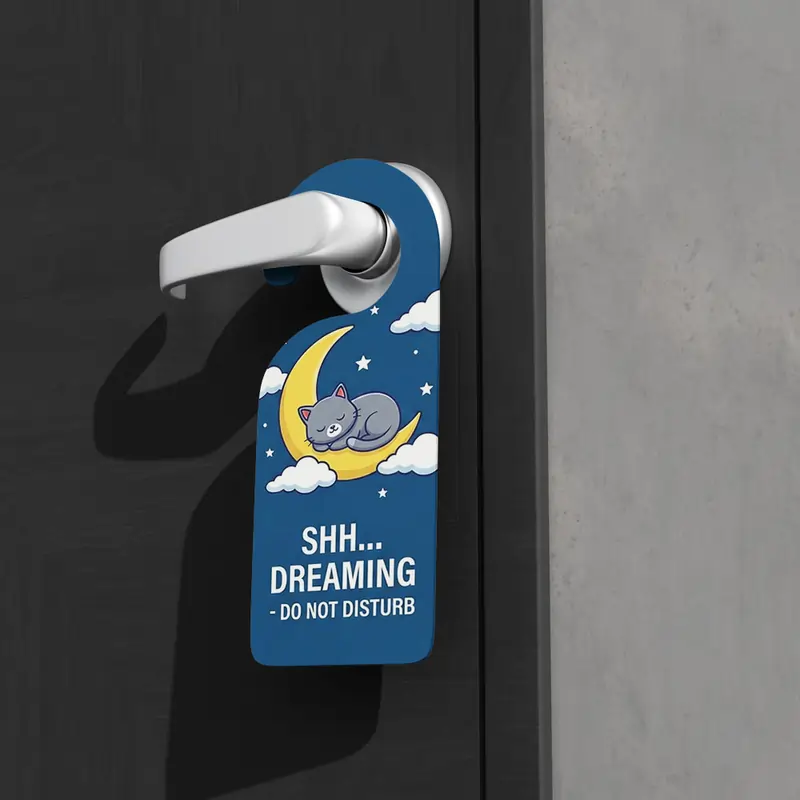 Cute "Shh... Dreaming" blue door hanger featuring a sleeping cat on a crescent moon.