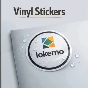 Vinyl stickers with a waterproof printed logo design, shown as a round label on a surface with water droplets to highlight durability and glossy finish.